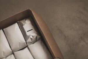 Closeup Opened Big Carton Box Full White Packages